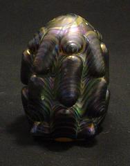 Small reduction paperweights, optic molded and snipped with shears, then melted down to round off the piece.