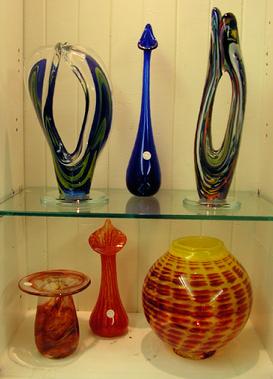Glass is blown to produce solid free-form sculptures and functional pieces of art.