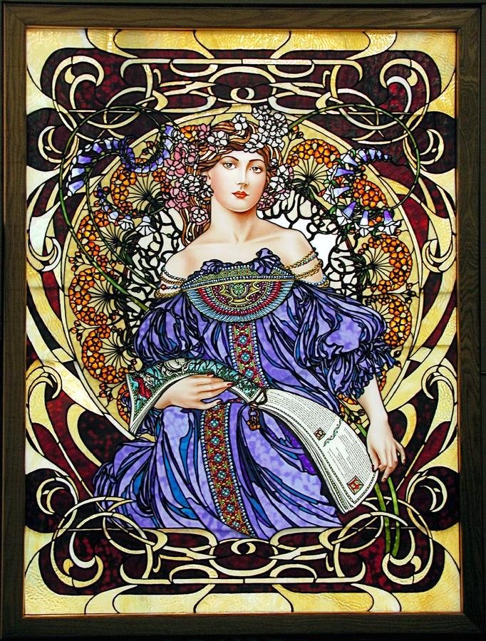 "DayDream" was inspired by Alphonse Mucha's work.  The lady pauses from reading Geoffrey Chaucer's "The Knight in Shining Armor" long enough to imagine herself in those times.  Sprays of flowers encircle her.  Each petal of each flower is hand selected to achieve color variation.  Ring mottled glass was used in the flower petals.