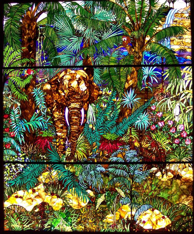 The Bogenriefs' observation that "Life is a Jungle out there", led to the creation of "The Jungle" stained glass panel which measures 10 feet by 12 feet and has details of trees, jungle flora, monkey, elephant, parrots, cockatoo, and other jungle features.
